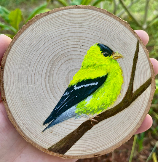 American Goldfinch on Wood Round